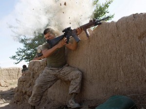 A U.S. Marine, from the 24th Marine Expeditionary Unit, has a close call after Taliban fighters opened fire near Garmser in Helmand Province of Afghanistan May 18, 2008. The Marine was not injured. (REUTERS/Goran Tomasevic) 
